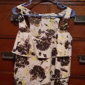 Sleeveless summer blouse, large bright yellow and very dark brown flowers.